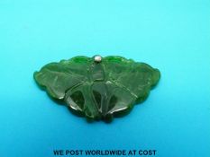 An apple green carved jadeite butterfly pendant set with a diamond