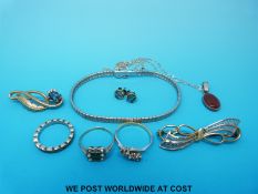 Two 9ct gold and silver rings, a silver bracelet,