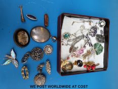 A silver Iona brooch, a hallmarked silver brooch large white metal locket,