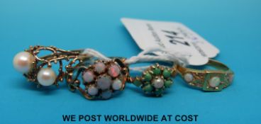 An 18ct gold ring set with three opals and four diamonds and three 9ct gold rings one set with