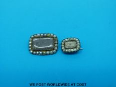 Two Victorian yellow metal mourning brooches set with plaited hair within a border of seed pearls,