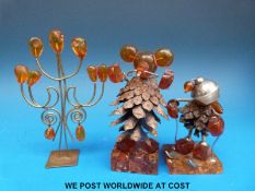 Three statues made from amber,