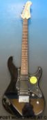 A Yamaha electric guitar in black lacquer finish