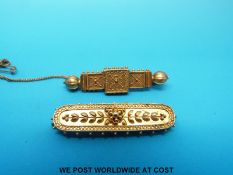 Two yellow metal brooches marked 15ct gold with filigree and ball design