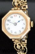 Swiss made 9ct gold ladies wristwatch with Arabic numerals and gilt markers to the white enamel