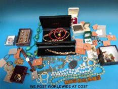 A quantity of costume jewellery to include jadeite beads, silver cufflinks,