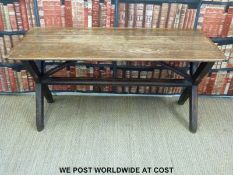 An 18thC/19thC pine Tavern table with cross framed legs united by a single stretcher and two