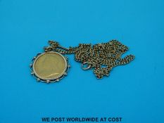 A 1893 gold half sovereign in 9ct gold mount on a 9ct gold chain (11g)