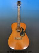 A Laredo acoustic guitar in soft carry case.