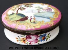 An 18thC enamel pill or patch box decorated with figures, river and house, 2.