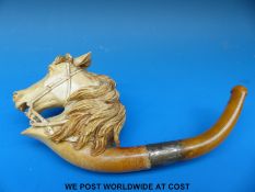 A Meerschaum pipe in the form of a horse's head with baltic amber stem
