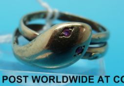 A 9ct gold ring modelled as a snake with ruby eyes (size Q)