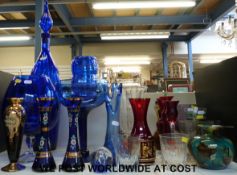 A collection of retro glass including oversize blue glasses, Murano clowns,