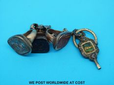 Three intaglio seal fobs and an ornate watch key