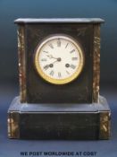 A 19th century black slate mantel clock with marbled decoration,