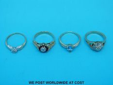 Four 9ct gold rings, one set with diamond and sapphires,