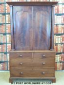 A 19thC mahogany linen press with show octagonal supports over two over two graduated drawers