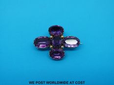 A Victorian yellow metal brooch set with amethysts.