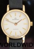Garrard 9ct gold cased ladies wristwatch with gold hands and baton numerals on cream face,