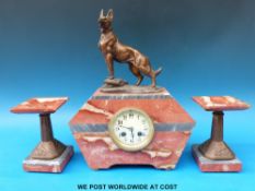 An Art Deco red marble and spelter clock garniture ivory coloured dial Arabic numerals,