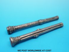 A white metal propelling pencil with hardstone finial decorated with flowers and foliage,