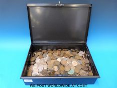 A large metal cash box containing a large amount of copper,