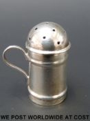 A Victorian hallmarked silver novelty pepper formed as a miniature flour shaker,