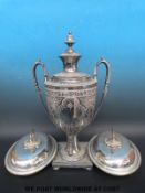 A silver plated twin handled urn or samovar with floral decoration (height 52cm) together with a