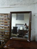 A wall mirror with bevelled glass (overall size 73 x 98cm)