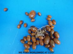 An amber necklace consisting of over 40 graduated ovoid beads, the largest 30x22mm, 54g.