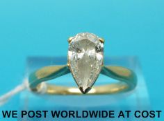 An 18ct gold ring set with a pear cut diamond of approximately 1.