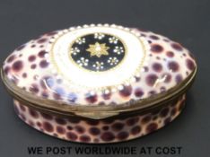 An 18thC jewelled Bilston enamel pill box decorated as a cowrie shell. 2.3cm tall and 5.2 x 3.