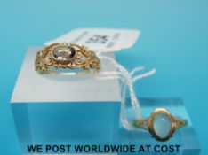 A 9ct gold ring set with a moonstone and a 9ct gold ring set with a smoky quartz (7g)