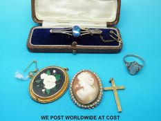 A yellow metal cross pendant, cameo brooch,