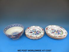 A collection of relief moulded English stone plates with an Oriental-style soup plate and one other