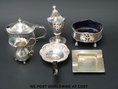 Three various hallmarked silver peppers etc, a small hallmarked silver jug,