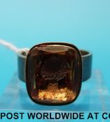 A yellow metal ring set with an intaglio depicting a wheatsheaf (size O/P)