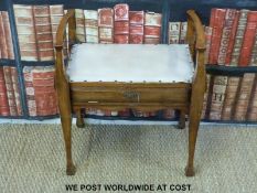 An Art Nouveau upholstered piano stool (H63 x W64 x D40cm)