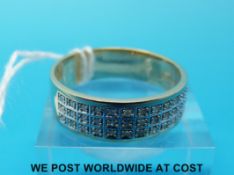 A 9ct gold gents ring set with three rows of diamonds (size V/W)