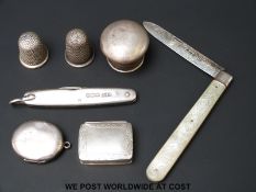 Two hallmarked silver folding knives, silver pill box, locket,