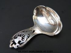 A Scottish hallmarked silver caddy spoon with pierced thistle design to handle,