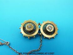 A Victorian brooch of circular design set with old mine cut diamonds