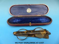 A pair of pique work lorgnettes/spectacles in a case marked 'Dixey,