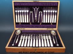 A mahogany cased twelve place setting fruit and nut service