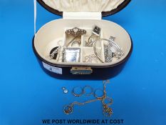 A small jewellery box containing three 9ct gold rings, silver bracelets,
