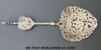A Victorian hallmarked silver repoussé decorated and pierced sifter spoon with bird finial B/ham