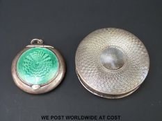 A hallmarked silver compact decorated with green guilloche enamel (diameter 4cm) and another