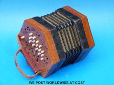 A c1900 30-key Anglo concertina with wooden fretworked ends, steel reeds,