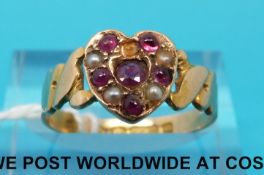 A 15ct gold ring set with rubies and seed pearls in a heart shape (size O)