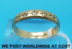 A 9ct gold ring set with five diamonds (size R)
